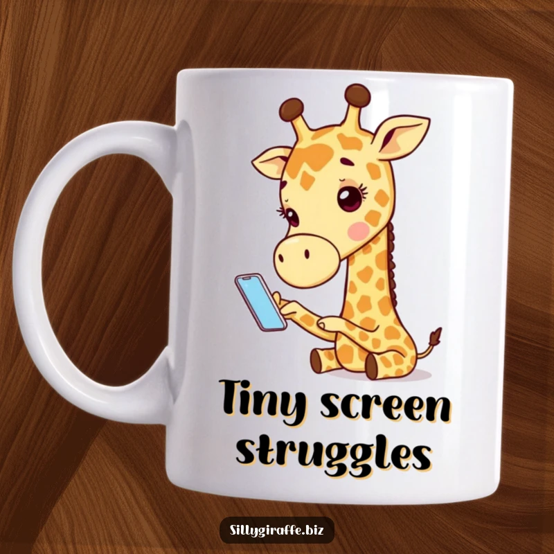 Funny mug with an adorable giraffe character comically trying to use a comically small smartphone, depicting a humorous tech struggle.